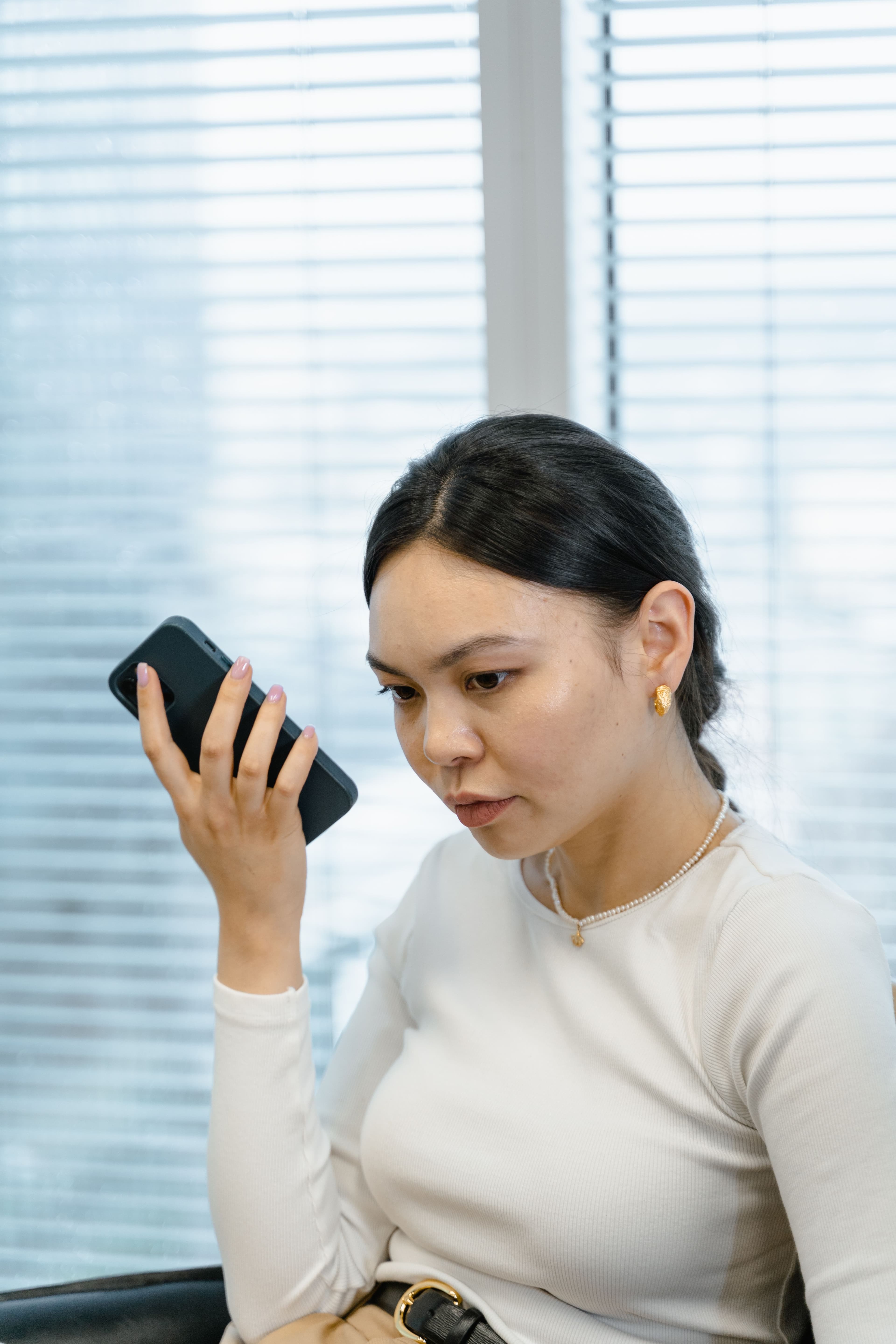 A team member speaking into a phone during a Noah interview.
